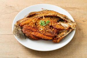 Fried Sea Bass Fish with Garlic photo