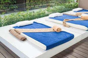 Outdoor massage bed in a spa salon photo