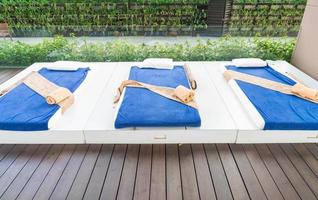 Outdoor massage bed in a spa salon photo