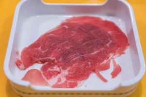 Fresh pork sliced for shabu photo