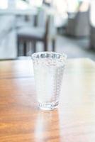 Glass of water on the table photo