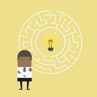 Businessman in front of a huge maze and finding direction to bulb. vector