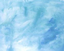 Blue watercolor background. Painted texture. Concept with copy space photo