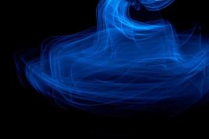 Glowing abstract curved blue lines photo