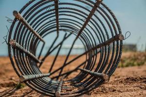 Steel rod used for poles construction at construction site photo