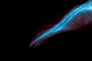 Glowing abstract curved blue and red lines photo