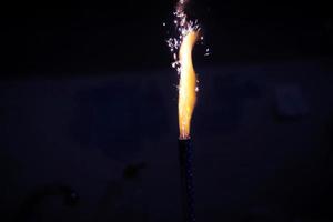 Fireworks burned in in the dark. High flame with sparks. photo