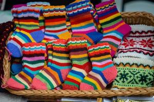 Traditional Latvian knitted woolen mittens and socks photo