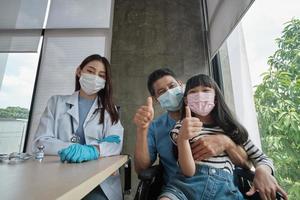 Asian girl and father taking a selfie vaccinating. photo