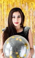 woman celebrating her birthday holding balloon photo