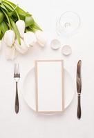 Mock up menu frame in restaurant or cafe. Top view of table setting photo
