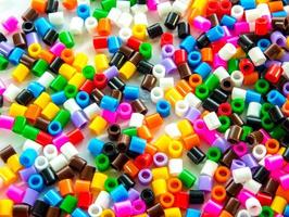 Texture of multicolor beads, colorful background photo