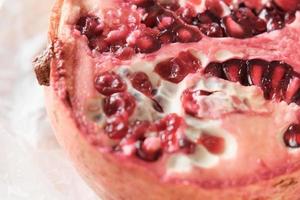 cut of ripe pomegranate, half of juicy pomegranate photo