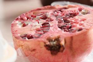 cut of ripe pomegranate, half of juicy pomegranate photo