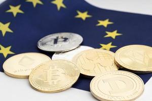 roup of crypto coins on European Union flag. Cryptocurrency on Europe photo