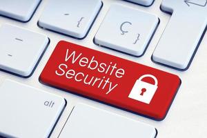 Website Security word and padlock icon on red computer keyboard photo