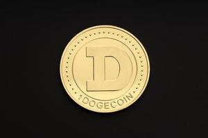 Dogecoin coin isolated on black background. Cryptocurrency. Top view photo