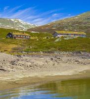 Vavatn lake panorama landscape huts snowy mountains Hemsedal Norway. photo