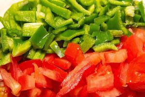 Chopped green peppers and tomatoes