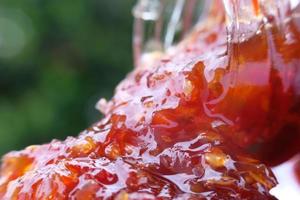 Close up chilli sauce on table, macro chilli sauce photo