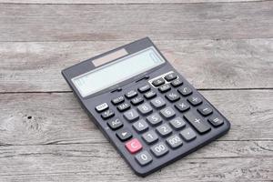 Close up calculator on wood table photo