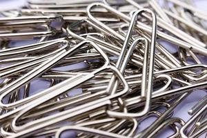 Close up paper clip on white background photo