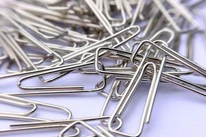 Close up paper clip on white background photo