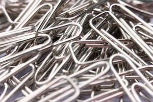 Close up paper clip on white background photo