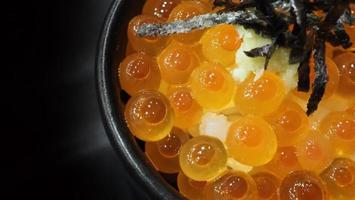 Salmon Ikura Roe served with rice and top with seaweed