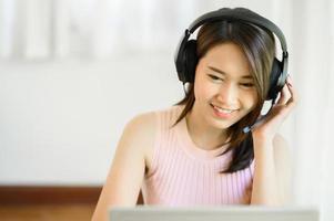 woman wearing a headset working at home photo