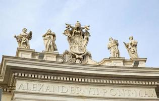 Marble sculptures of the popes on St. Peters Square in Vatican City photo