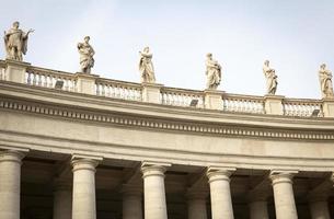 Marble sculptures of the popes on St. Peters Square in Vatican City photo