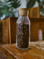 Coffee beans inside of bottle photo