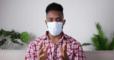 Young Man Wearing Face Mask Talking to Camera video