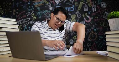 Teacher Talking on Phone During Checking Report Paper video