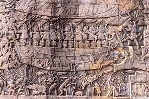 Stone carvings on the walls of the Bayon Temple in Angkor Thom photo