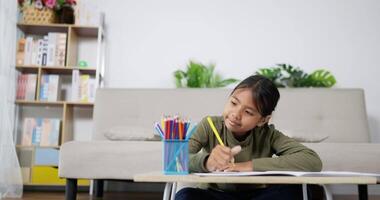 Happy Girl Drawing at A Table video