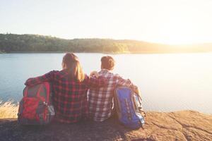 backpackers enjoying with nature view. Couple adventure lifestyle. photo