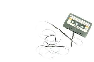 Vintage compact cassette tape on white background photo