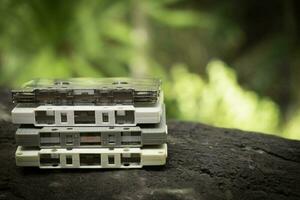 Compact cassette on table background photo