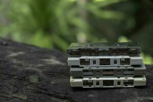 Compact cassette on table background photo