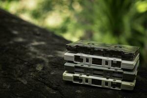 Compact cassette on table background photo