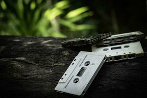 Compact cassette on table background photo