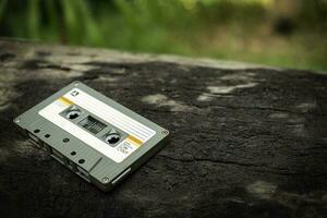 Compact cassette on table background photo