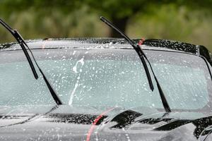 washing car with foam in summer photo