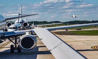 busy airport tarmac traffic before airplanes take off photo