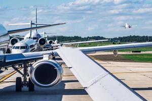 busy airport tarmac traffic before airplanes take off photo