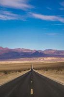 lonely empty road to deth valley national park photo