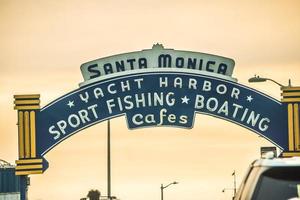 santa monica pier on pacific coast at sunset photo