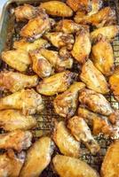Chicken wings fried from the oven ready for consumption photo
